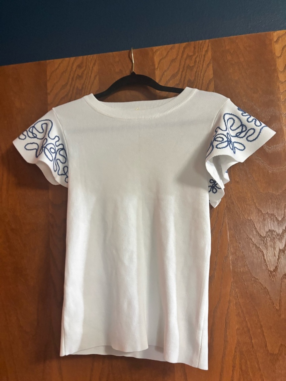 White Knit Top with Blue Embroidered Flutter Sleeves